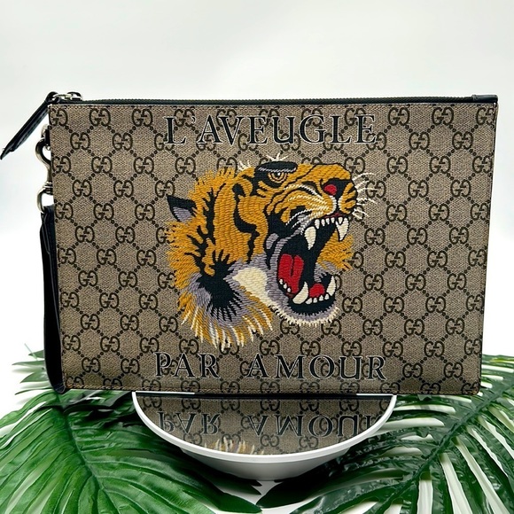 Gucci Handbags - GUCCI GG Supreme Tiger Clutch Bag Leather Like New